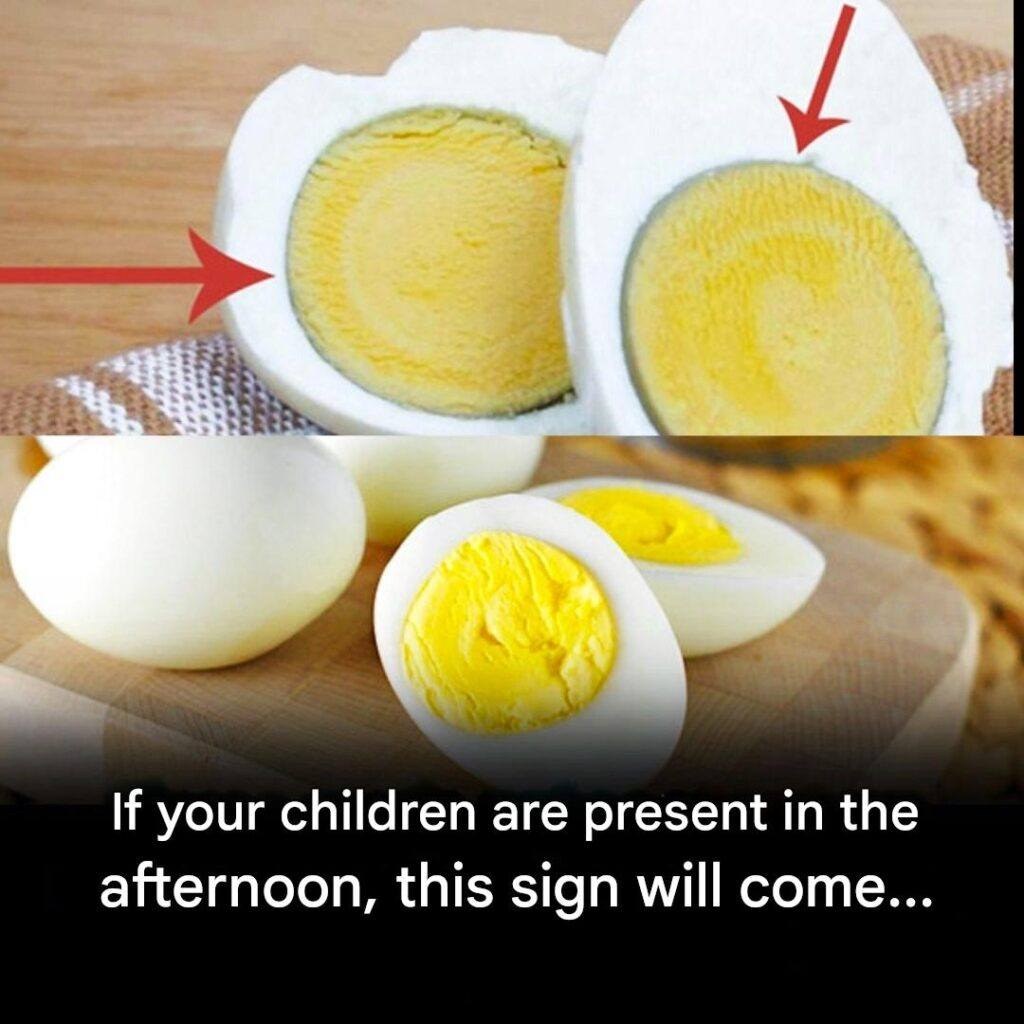 What causes the green ring around the yolk of hard-boiled eggs?